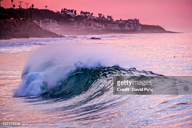 sea wave at sunset, malibu, california, usa - malibu foto e immagini stock