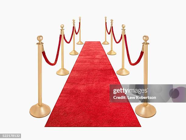red carpet and red velvet ropes - red velvet material stock-fotos und bilder