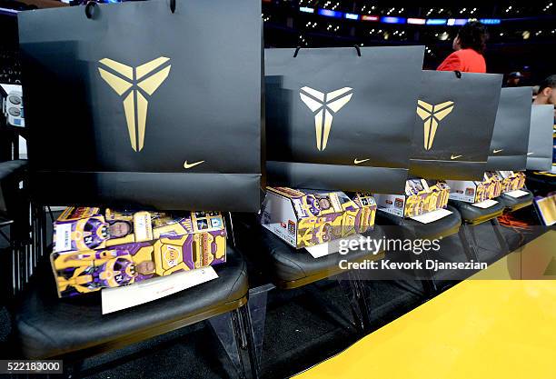 Kobe Bryant branded merchandise is seen on the seats at Staples Center for each fan in attendance at the final game of Kobe Bryant's career on April...