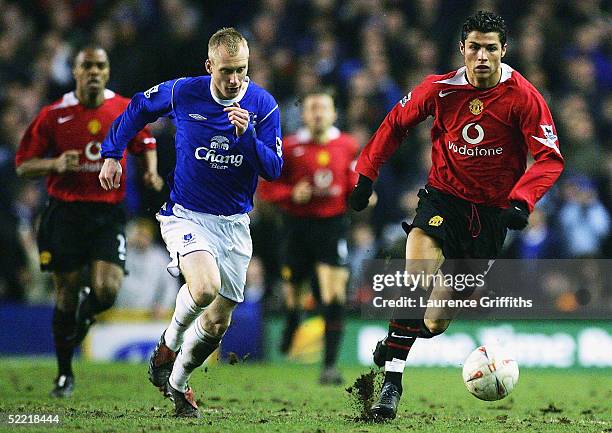 Cristiano Ronaldo of Manchester United battles for the ball with Tony Hibbert of Everton during the FA Cup Fifth Round match between Everton and...