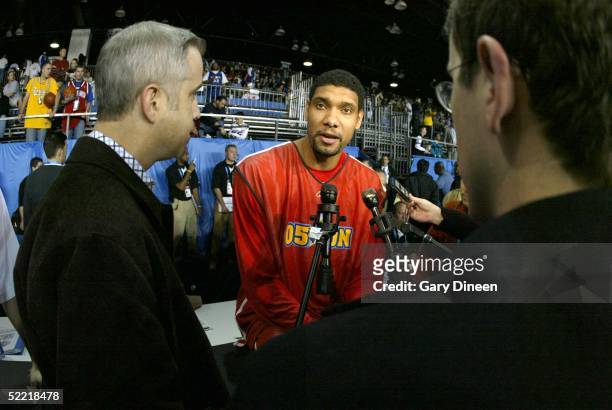 Tim Duncan of the West answers questions from the media on Center Court of Jam Session in the Colorado Convention Center during 2005 NBA All-Star...
