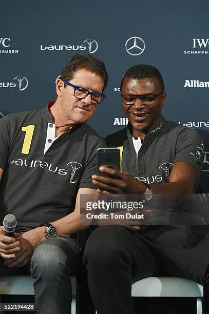 Laureus World Sports Academy member Marcel Desailly with Laureus Ambassador Fabio Capello takes a selfie during the Football press conference prior...