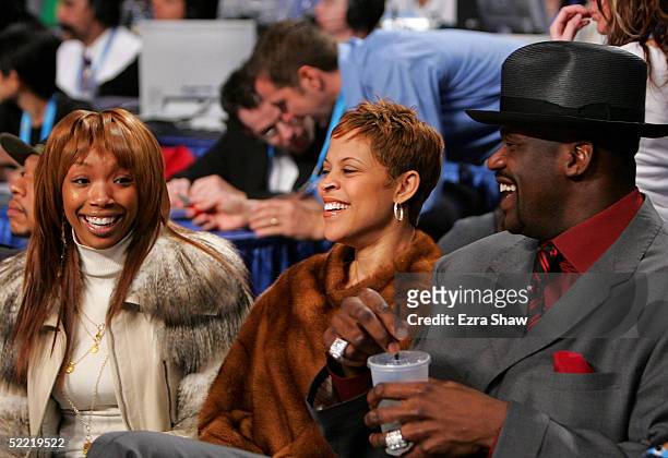 Actress/singer Brandy, Shaunie O'Neal and Shaquille O'Neal of the Miami Heat sit courtside during the Foot Locker Three-Point Shootout, part of 2005...