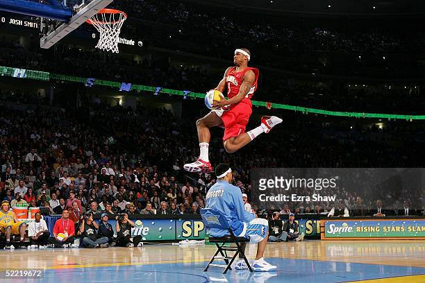 Josh Smith of the Atlanta Hawks jumps over Kenyon Martin of the Denver Nuggets in the Sprite Rising Stars Slam Dunk compeition, part of 2005 NBA...