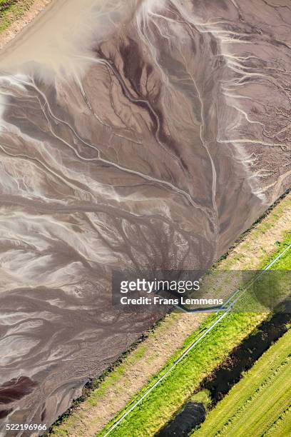 netherlands, raising of agricultural land by adding mud water in polder. aerial - reclamation stock pictures, royalty-free photos & images