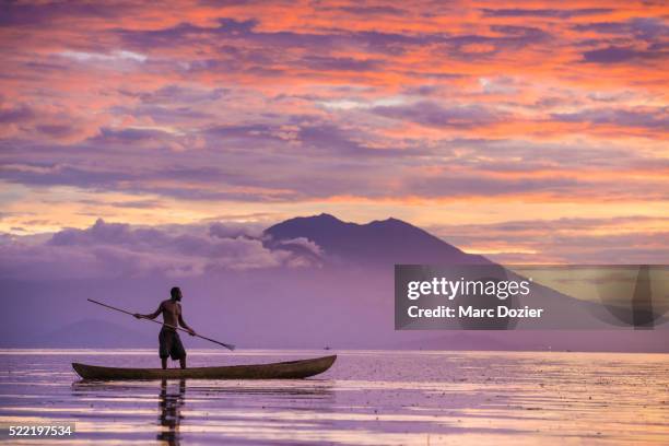 fisherman shadow - papua new guinea stock pictures, royalty-free photos & images