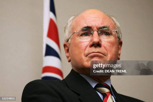 Australian Prime Minister John Howard listens during a joint press conference with New Zealand Prime Minister Helen Clark at the Langham Hotel in...