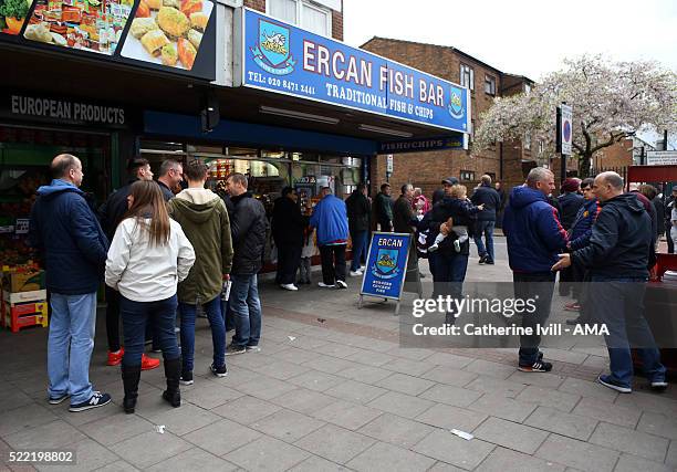 General view as fans queue up for fish and chips close to the stadium before the Emirates FA Cup Sixth Round Replay match between West Ham United and...