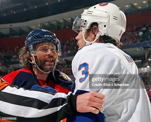 Jaromir Jagr of the Florida Panthers grabs and shoves Travis Hamonic of the New York Islanders in Game One of the Eastern Conference Quarterfinals...