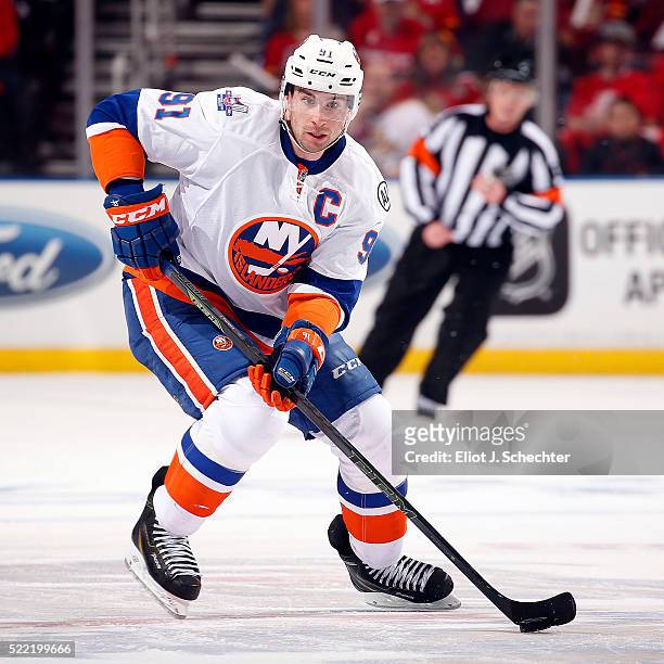 John Tavares of the New York Islanders skates with the puck against the Florida Panthers in Game One of the Eastern Conference Quarterfinals during...