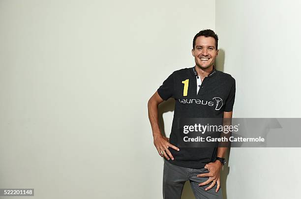 Laureus Ambassador and Laureus World Action Sportsperson of the Year Award nominee Jan Frodeno poses at Brandenburg Gate on April 18, 2016 in Berlin,...