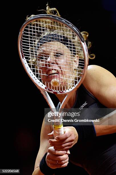 Laura Siegemund of Germany plays a backhand in her match against Polona Hercog of Slovenia during Day 1 of the Porsche Tennis Grand Prix at...