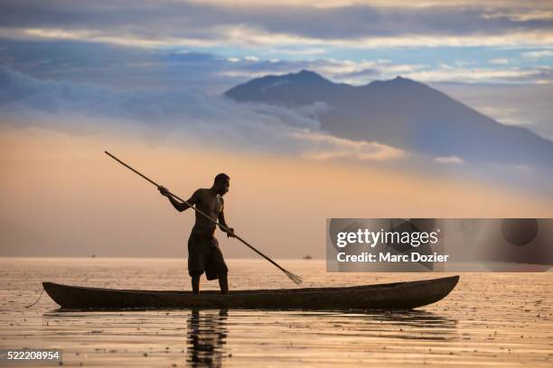 fisherman shadow - papua stock pictures, royalty-free photos & images