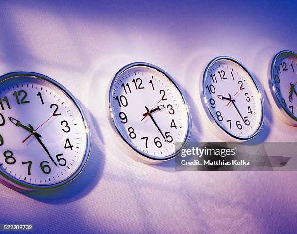 four office clocks - time lapse clock stock pictures, royalty-free photos & images