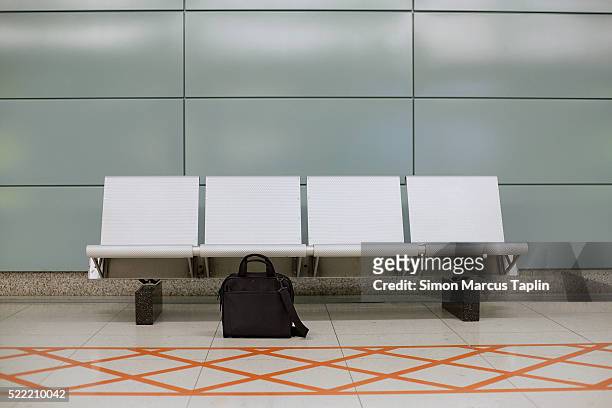 forgotten luggage - subway bench bildbanksfoton och bilder