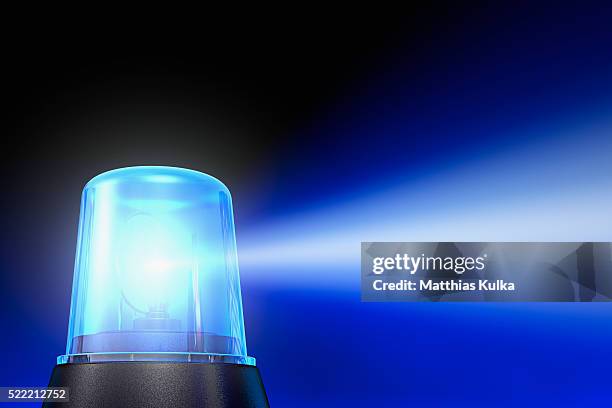 flashing blue light - emergency light stock pictures, royalty-free photos & images