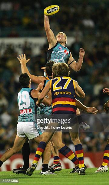Kane Cornes for Port Adelaide flies up for a mark in the AFL Wizard Cup Round 1 match between the Adelaide Crows and Port Adelaide Power at AAMI...