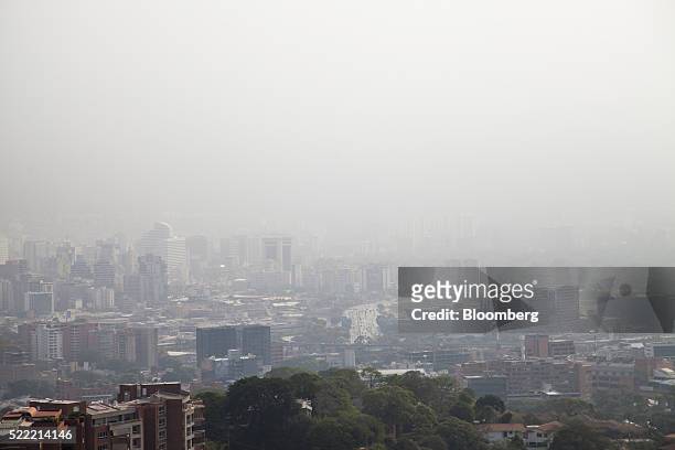 Smog hangs over the city in Caracas, Venezuela, on Saturday, April 16, 2016. Adding to Venezuela's economic woes, a dense ash-filled smog has...