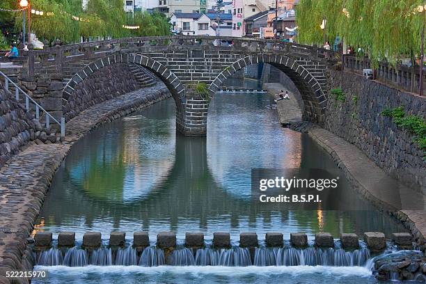 nagasaki's megane-bashi stone bridge in kyushu, japan - arch bridge stock pictures, royalty-free photos & images