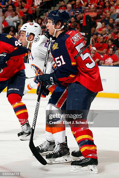 Brian Campbell of the Florida Panthers tangles with Frans Nielsen of the New York Islanders in Game One of the Eastern Conference Quarterfinals...