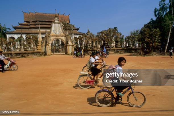 children returning from school - tibor bognar cambodia bildbanksfoton och bilder