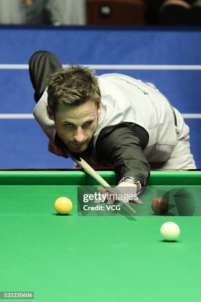 David Gilbert of England plays a shot in first round match against Ronnie O'Sullivan of England on day three of Betfred World Championship 2016 at...