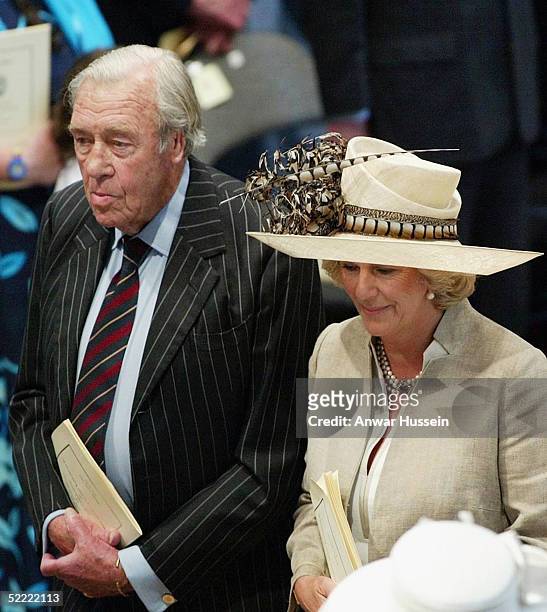 Camilla Parker Bowles, wearing a Philip Treacy hat, and her father Bruce Shand stand at Westminster Abbey on June 2, 2003 after the ceremony to mark...