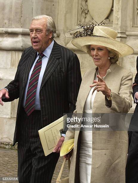 Camilla Parker Bowles, wearing a Philip Treacy hat, and her father Bruce Shand leave Westminster Abbey on June 2, 2003 after the ceremony to mark the...