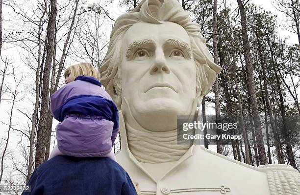 Caroline Wittich, 5-years-old, sits on her fathers shoulders as they stop and view the bust of President Andrew Jackson during a family trip to the...