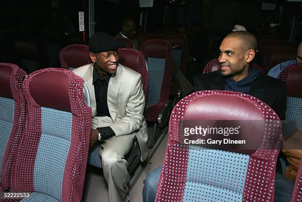 Dwyane Wade and Grant Hill of the Eastern Conference All-Stars share a laugh as they ride the bus to the Arena for the 54th All-Star Game, part of...
