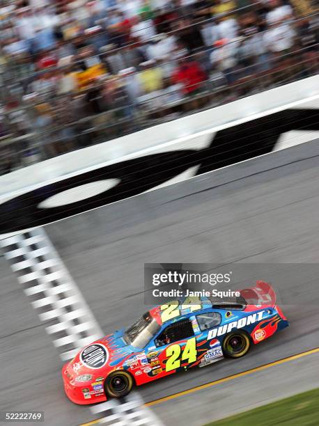 Jeff Gordon, driver of the Hendrick Motorsports Chevrolet, crosses the finish line to win the NASCAR Nextel Cup Daytona 500 on February 20, 2005 at...