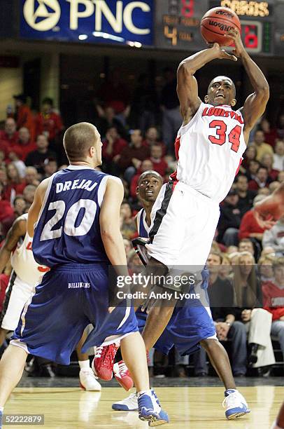 Larry O'Bannon of the Louisville Cardinals shoots the ball over Anthony Drejaj of the Saint Louis Billikens during the Conference USA game at Freedom...