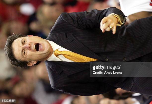 Head coach Rick Pitino of the Louisville Cardinals yells instructions to his team during a Conference USA game against the Saint Louis Billikens at...