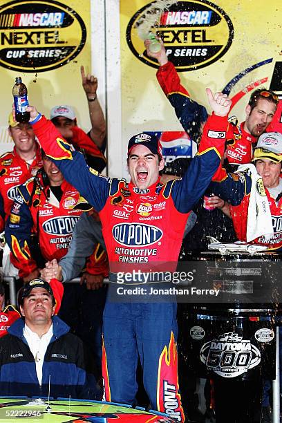 Jeff Gordon , driver of the Dupont Chevrolet, celebrates his victory during the NASCAR Nextel Cup Daytona 500 on February 20, 2005 at Daytona...