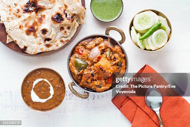 indian lunch with paneer tikka masala, dal makhani, naan, chutney and salad - paneer tikka stock pictures, royalty-free photos & images