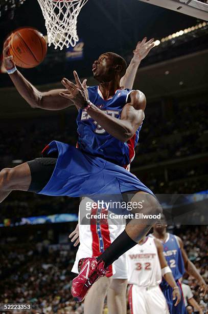 Dwyane Wade of the Eastern Conference All-Stars goes for a layup against the Western Conference All-Stars during the 2005 NBA All-Star Game at the...
