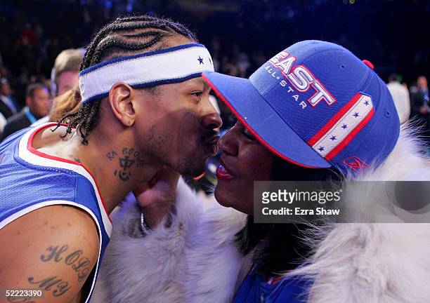Allen Iverson of the Eastern Conference All-Stars kisses his mom after receiving the MVP trophy after the East's win over the West in the 54th...