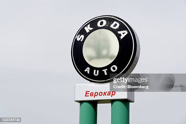 Skoda Auto a.s. Logo sits on display outside the Eurocar PJSC automotive plant in Solomonovo, Ukraine, on Monday, April 18, 2016. Ukraine's Eurocar...