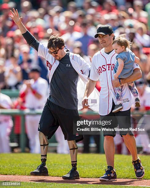 Boston Marathon bombing survivor Jeff Bauman and actor Jake Gyllenhaal are introduced before throwing out the ceremonial first pitch together before...