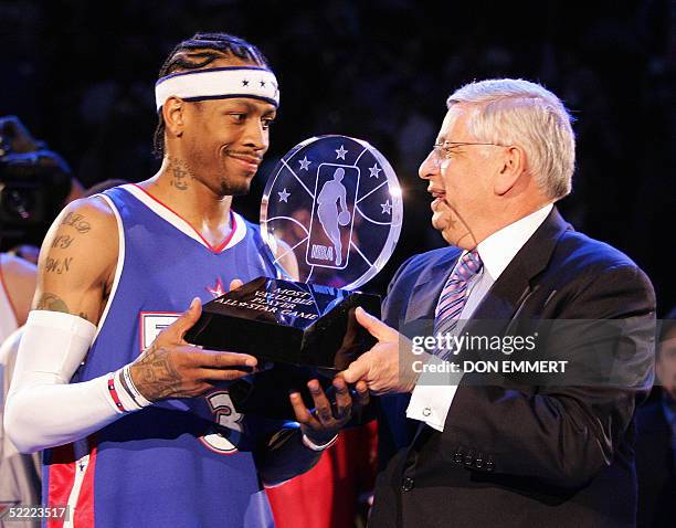 Commissioner David Stern hands Allen Iverson of the Eastern Conference team the All-Star Most Valuable Player trophy after the NBA All-Star game 20...