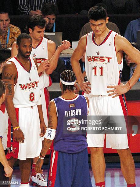 Chinese player Yao Ming and Kobe Bryant of the Western Conference team look at Allen Iverson during a break in the NBA All-Star game in Denver 20...