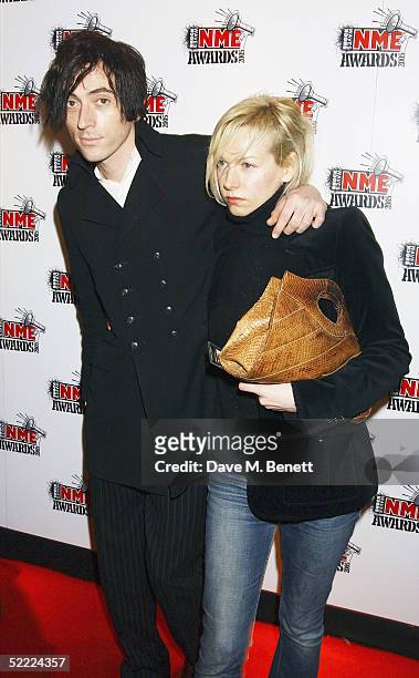 Babyshambles bassist Drew McConnell and guest arrive at The Shockwaves NME Awards 2005 at Hammersmith Palais on February 17, 2005 in London. The...