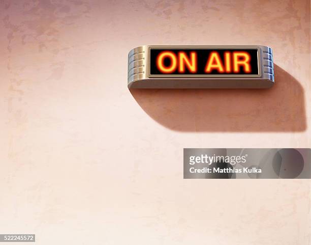 'on air' sign on wall - broadcasted stock pictures, royalty-free photos & images