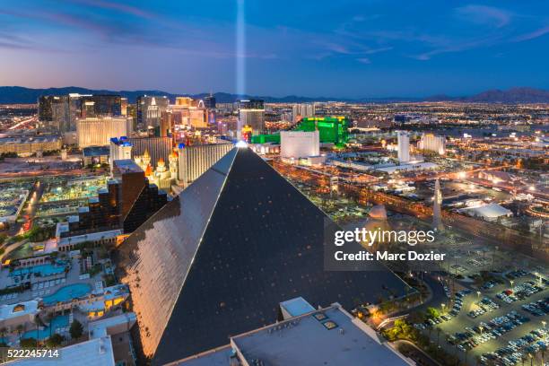 luxor hotel and the strip in las vegas - las vegas pyramid hotel stock pictures, royalty-free photos & images