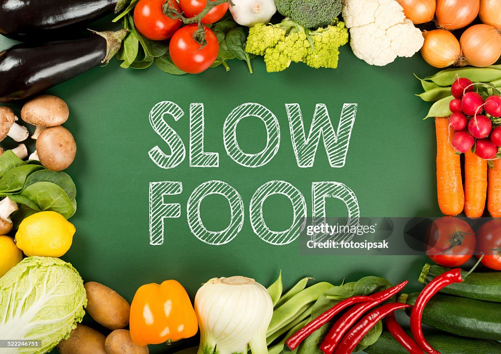Fresh organic vegetables on the "slow food" sign