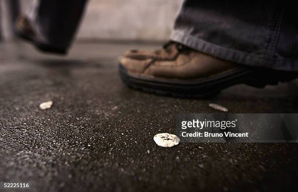 Some of the estimated 300,000 pieces of used chewing gum that litter Oxford Street are seen as pedestrians walk by, as capital cities are due to hold...