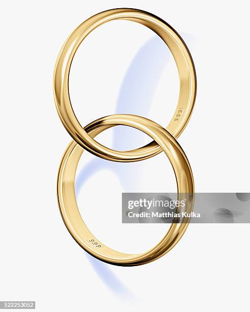 two interlocked wedding rings - bague photos et images de collection