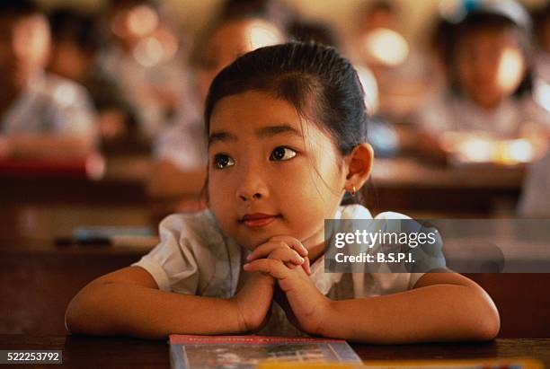 little girl in school in vietnam - vietnam school stock pictures, royalty-free photos & images