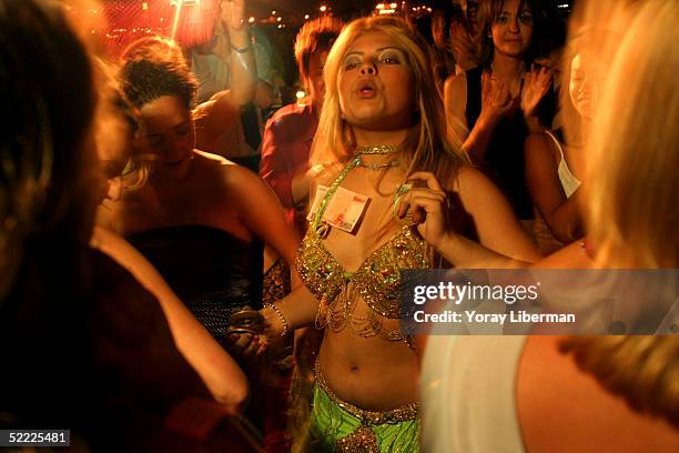 Belly dancer performs at a wedding on July 18, 2004 in the Kizkulesi area of Istanbul, Turkey. Kizkulesi is a small island on Bosphorus between the...