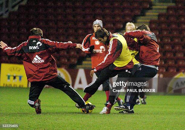 Bayer Laverkusen Dietmar Berbatov runs for the ball during a training session with his teammates before tomorrow night's UEFA Champions League clash...